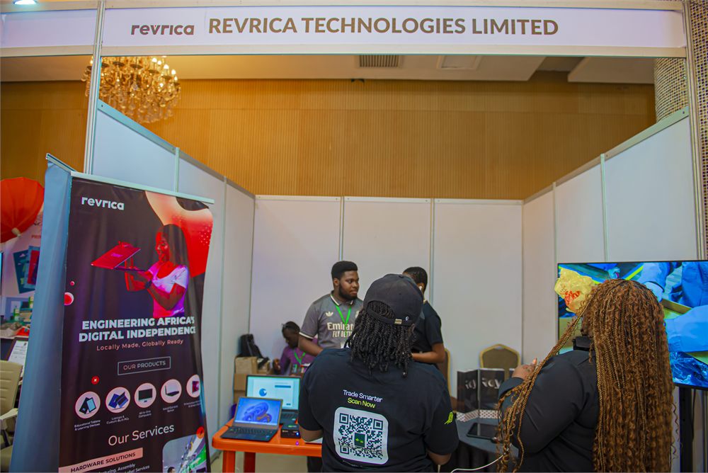Delegates viewing locally manufactured products at an exhibition stand