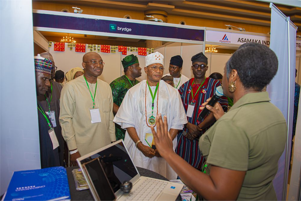 Dignitaries touring exhibition booths and engaging exhibitors