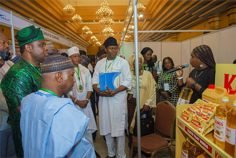 Food products exhibitor engaging delegates at the exhibition booth